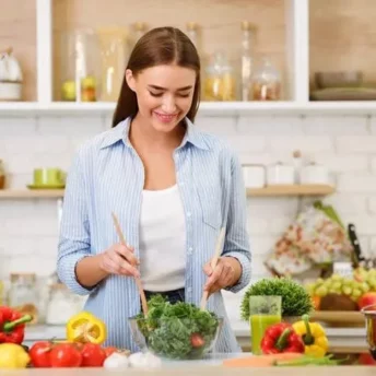 Woman cooking healthy recipes for weight loss