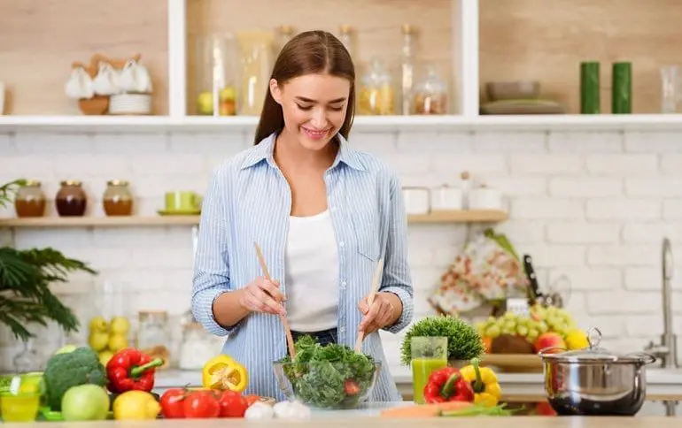 Woman cooking healthy recipes for weight loss