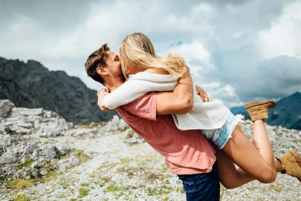 Couple hugging on the mountain