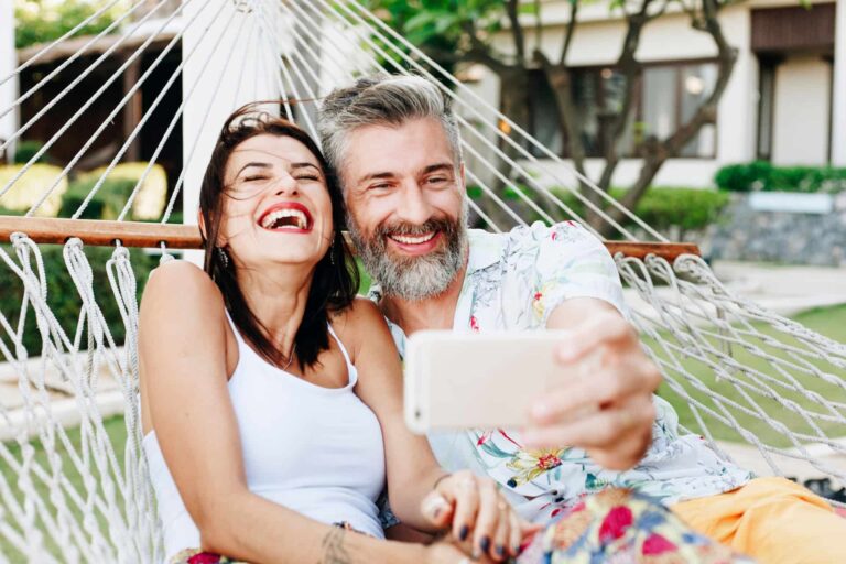 happy couple taking selfie