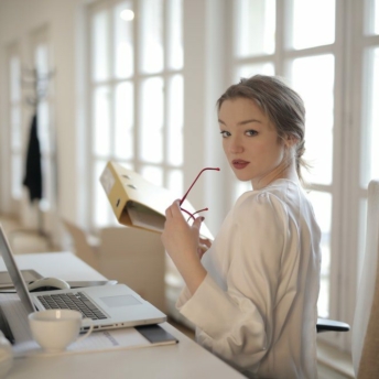 Woman holding a yellow office folder