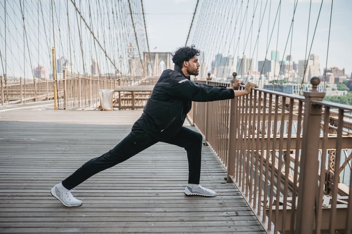 Man stretching on a bridge to show how to relax muscles