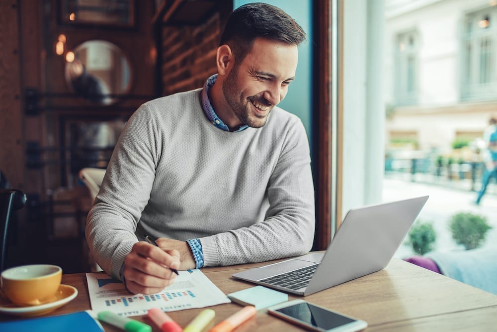 Man looking at his laptop