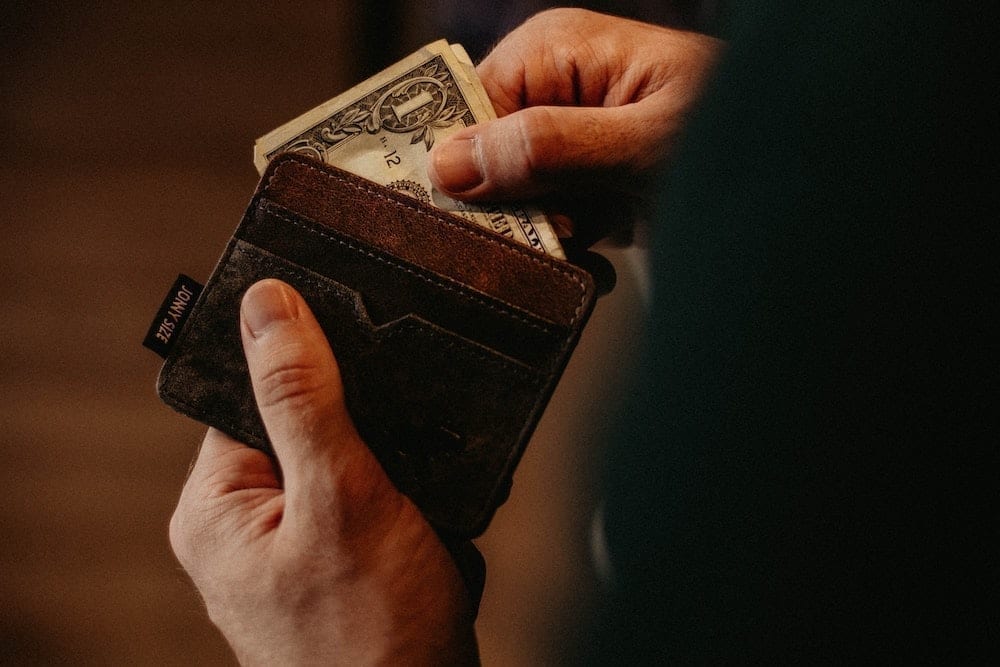 Man taking money out of his wallet