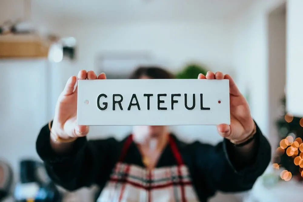 A man holding a plate Grateful