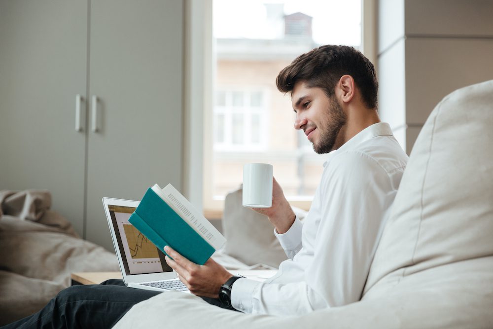 Man reading a book to keep his brain stimulated