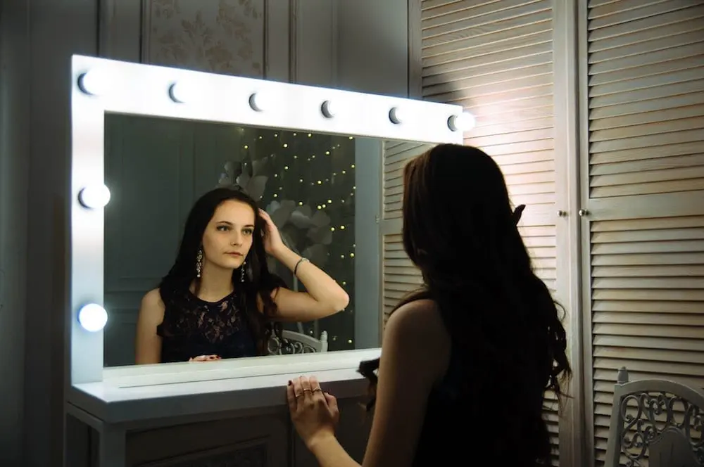 A Woman looking in a mirror