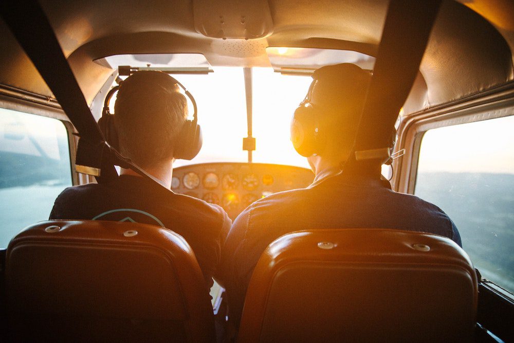 Two men flying a private plane for the ultimate bucket list