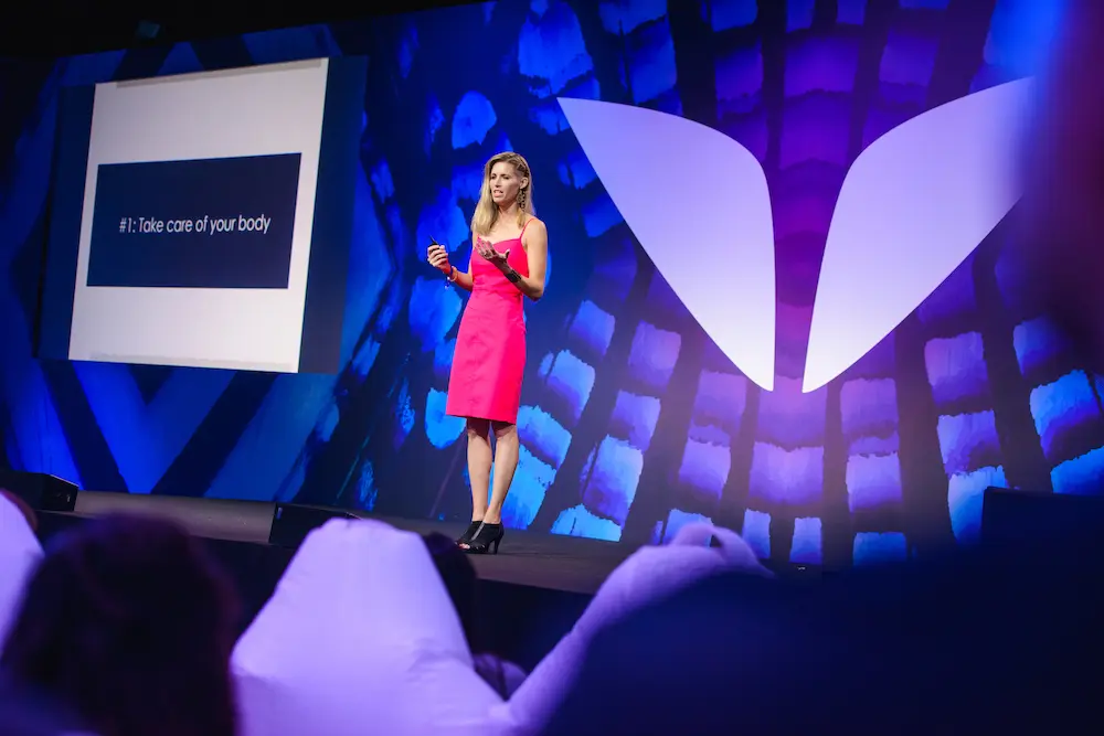 Dr. Amy Killen on stage at Mindvalley's A-Fest 2018 in Sardinia