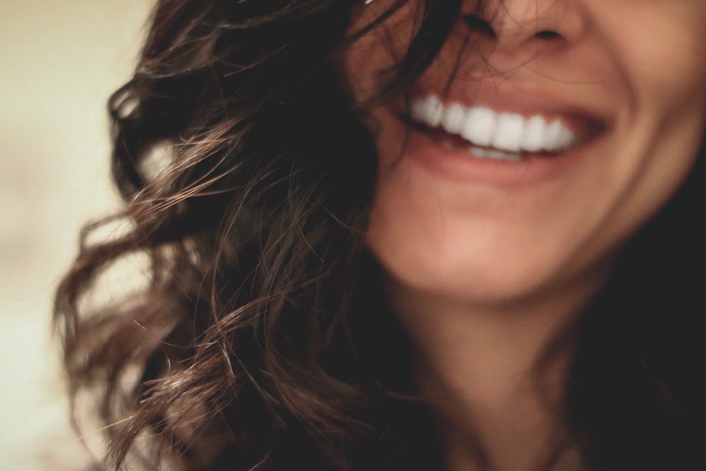 Woman smiling with teeth showing 