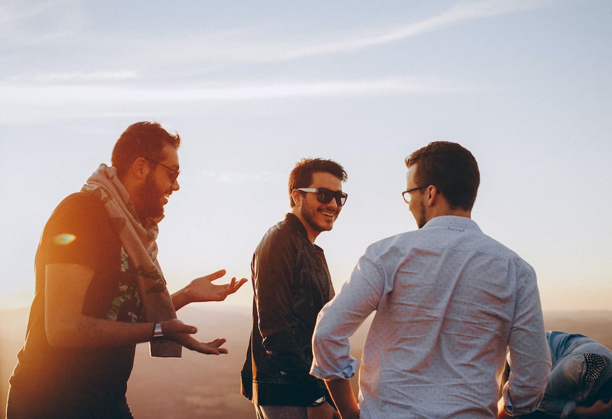 Group of male friends laughing with self-regulation