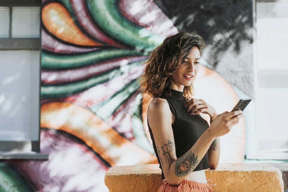 Beautiful woman distracted by a phone