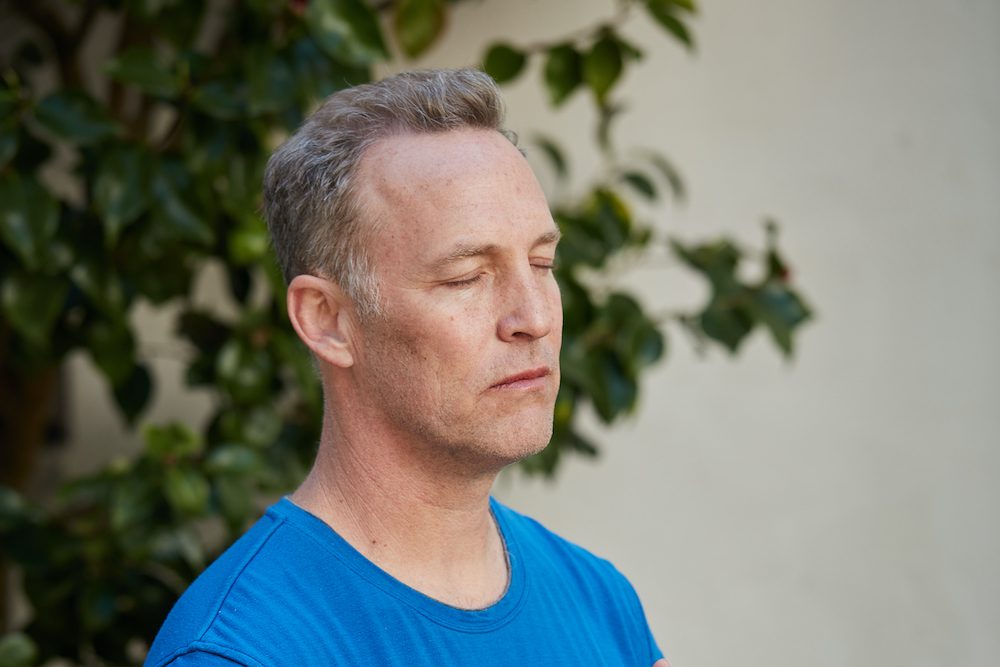 Lee Holden meditating
