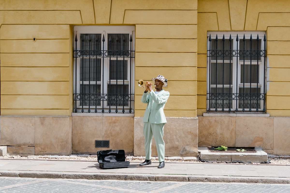 black man playing music on the street