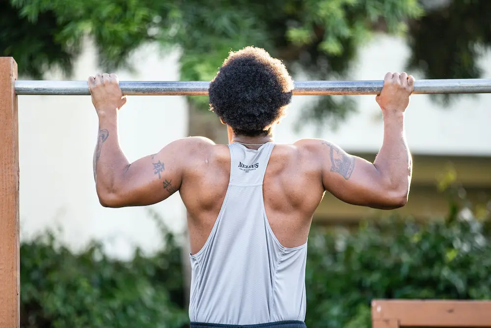 man doing pull ups for muscular endurance