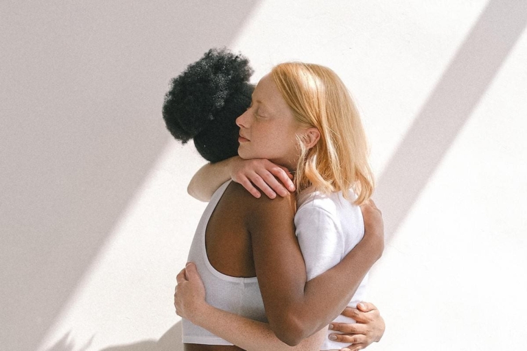 Women hugging to show what is forgiveness