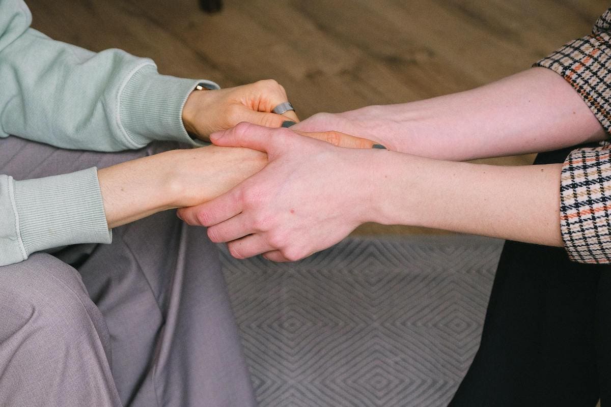 Hands holding to show what is forgiveness