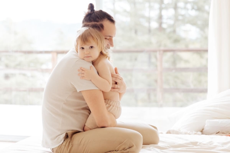 Father hugging his daughter to help her children's anxiety