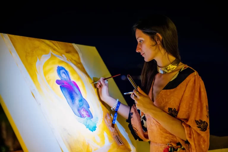 A woman in flow state while painting