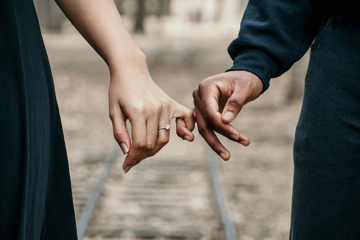 Pinkies interlaced as a sign of fear of intimacy