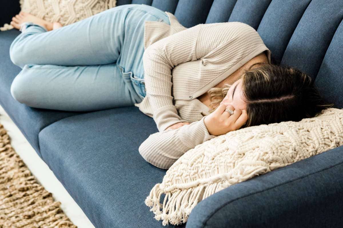 Woman taking a power nap on the couch