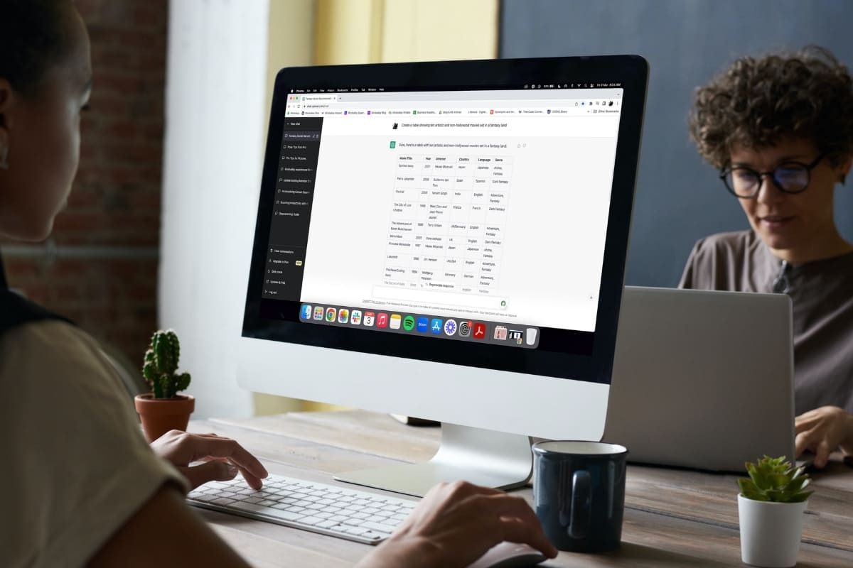 Woman working on a laptop, using AI to help with productivity