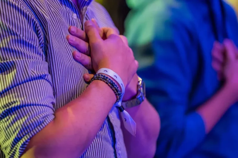 Man with his hands on his heart to show self-compassion