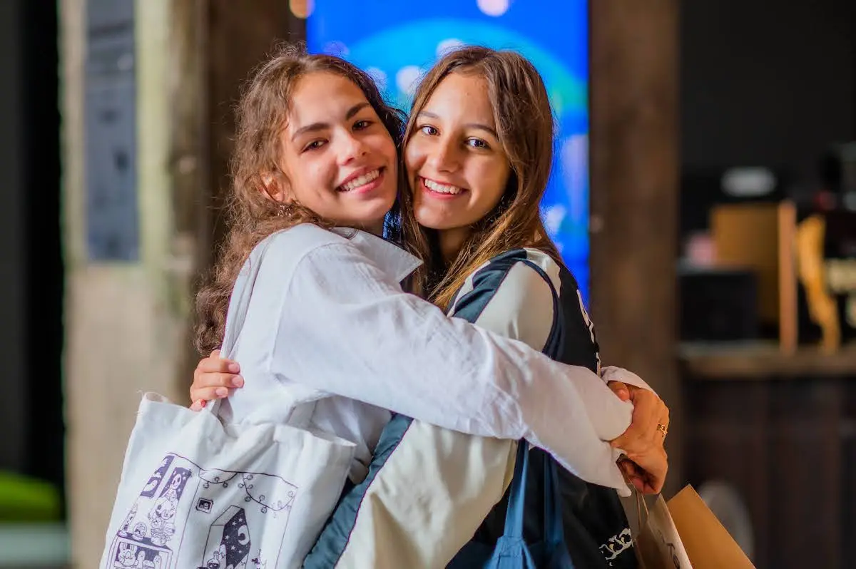 Teens hugging at Mindvalley University 2022 in Tallinn, Estonia