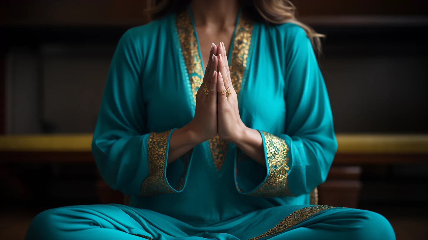 A woman meditating to release symptoms of blocked chakras