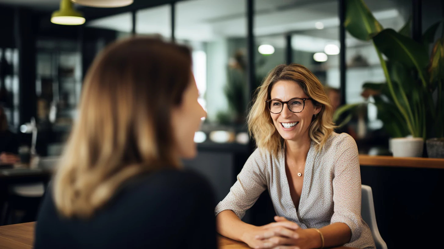 A female mentor in conversation with her mentee