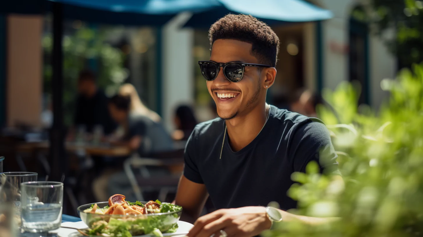 A man having a salad at an outdoor cafe