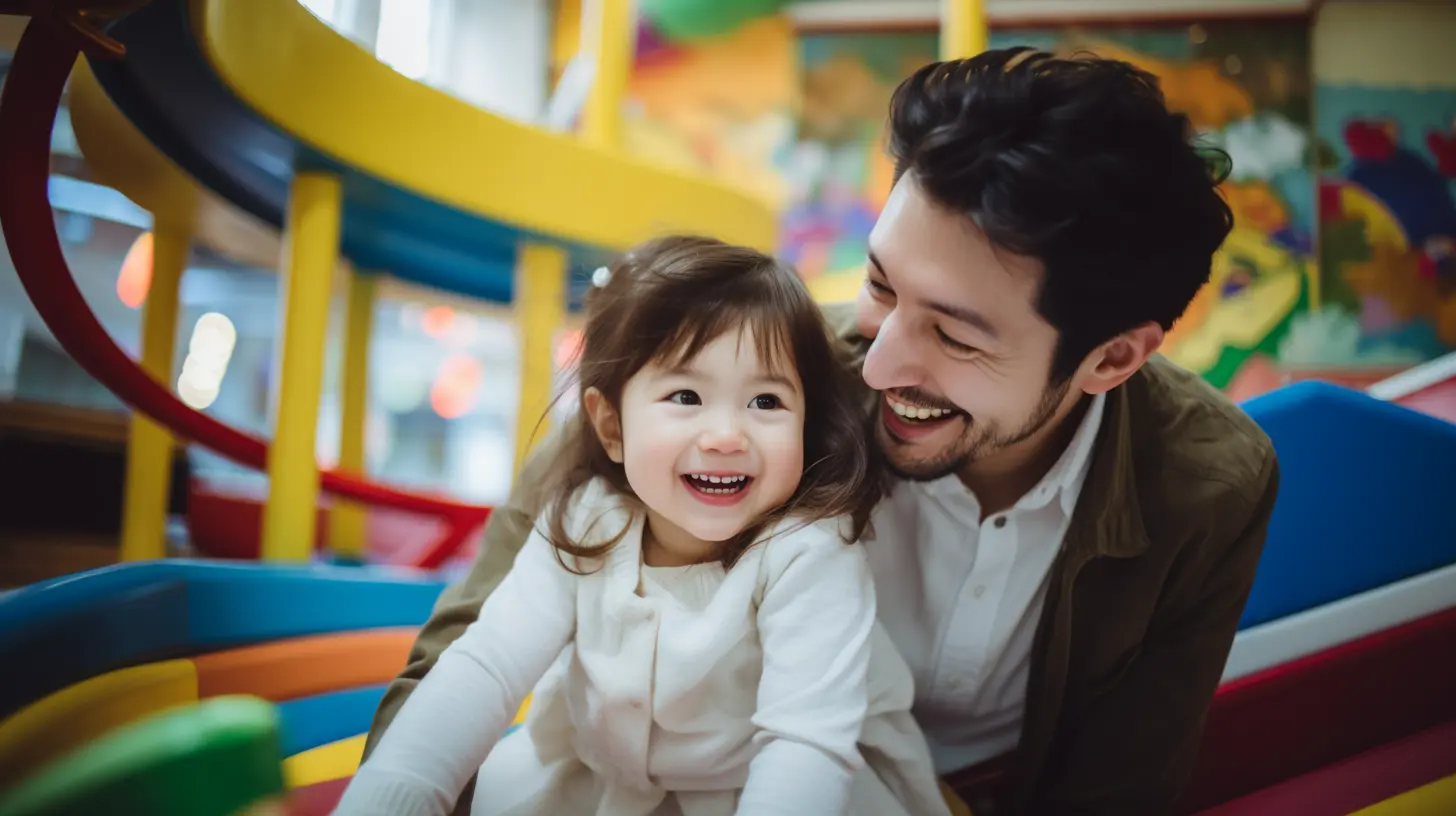 A father and his daughter playing in an indoor playground