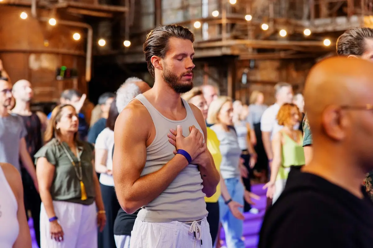 A man having a mindfulness moment with hands on his chest