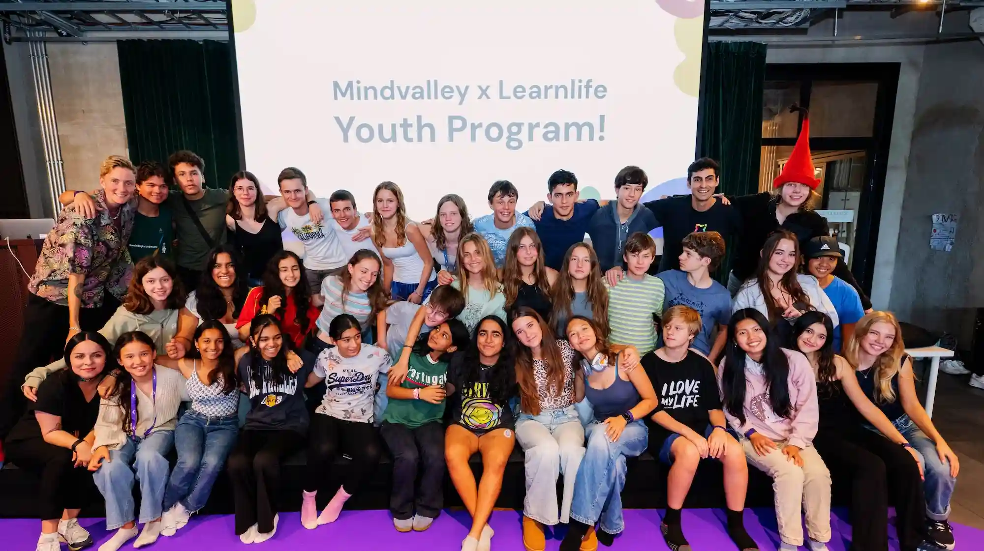 Learnlife and Mindvalley youth participants at Mindvalley University 2025, celebrating innovative education.