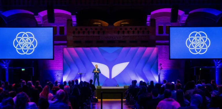 Vishen on stage at Mindvalley University in August 2025.