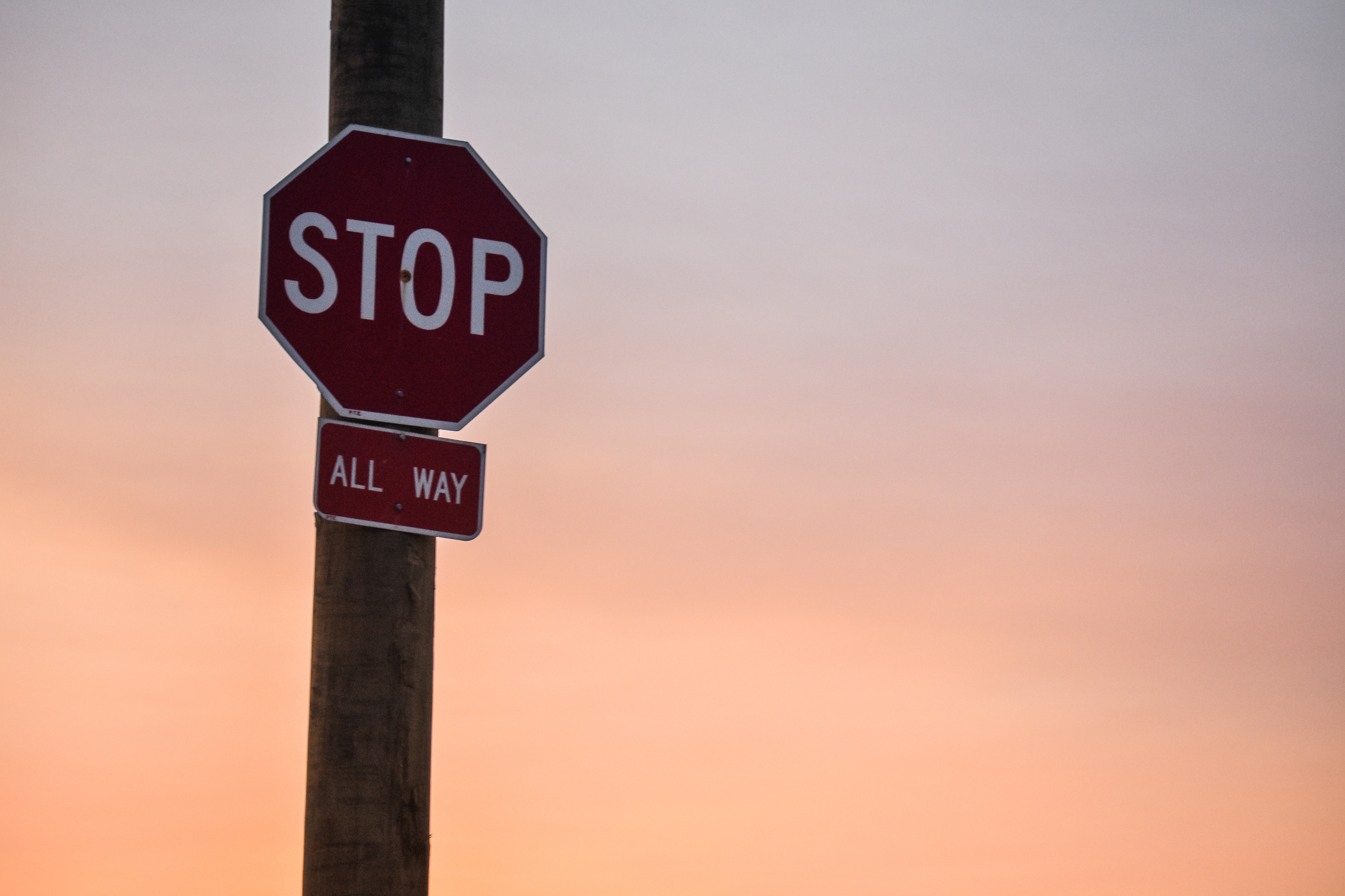 Stop All Way sign on post 