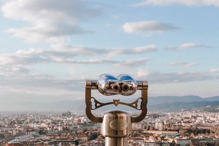 Binoculars overlooking city 