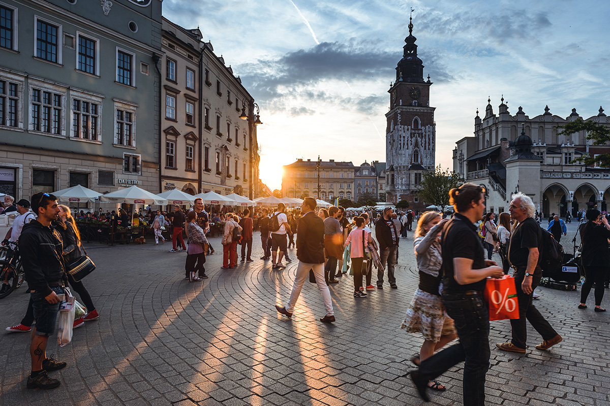 Busy Polish plaza at sunset