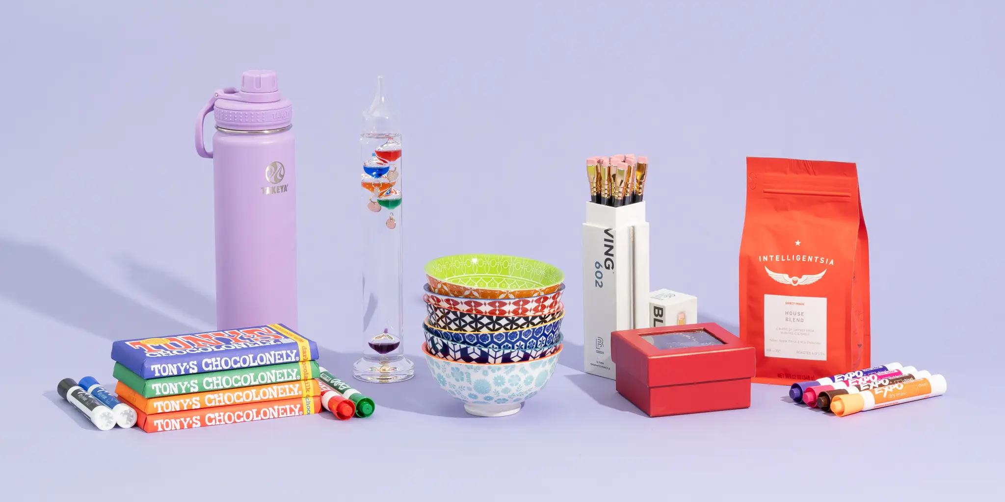 As assortment of our picks for best gifts for teachers on a purple background. 
