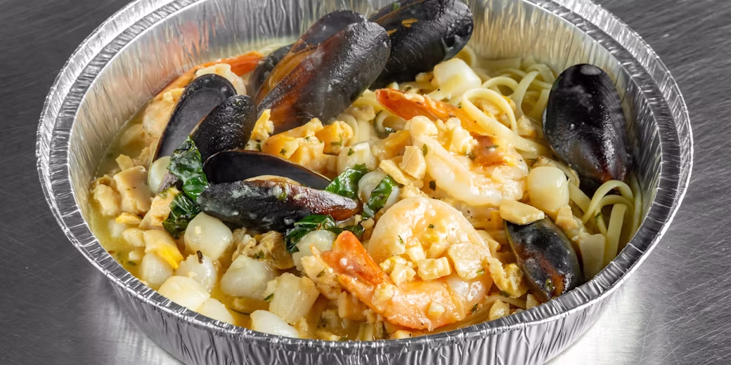 Seafood combo plated with pasta