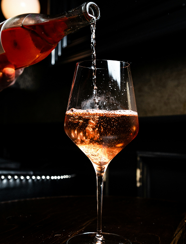 Wine being poured into a glass at SOHO