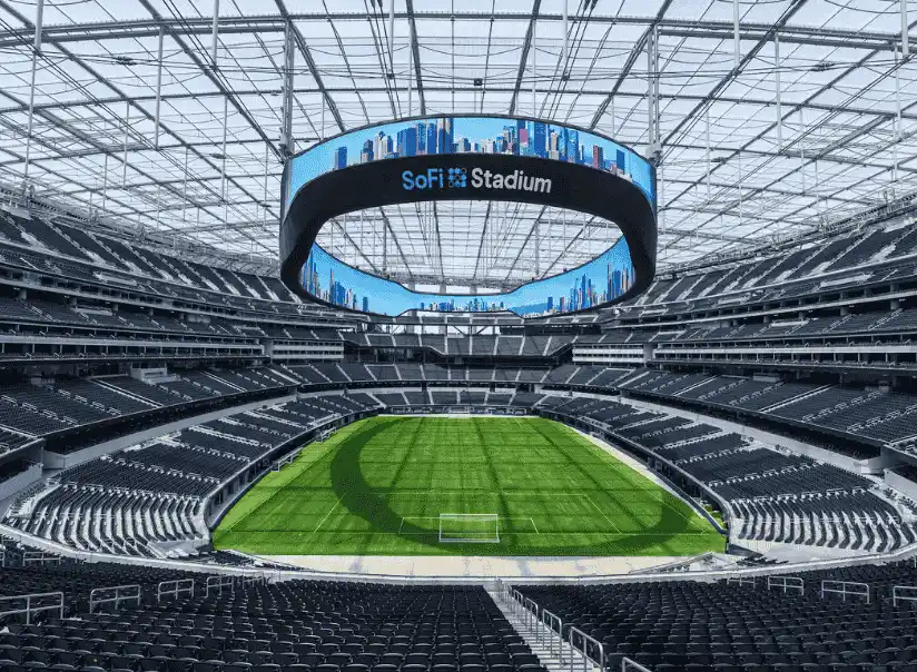 Interior view of Sofi Stadium, featuring a large circular display screen, ready for upcoming games.
