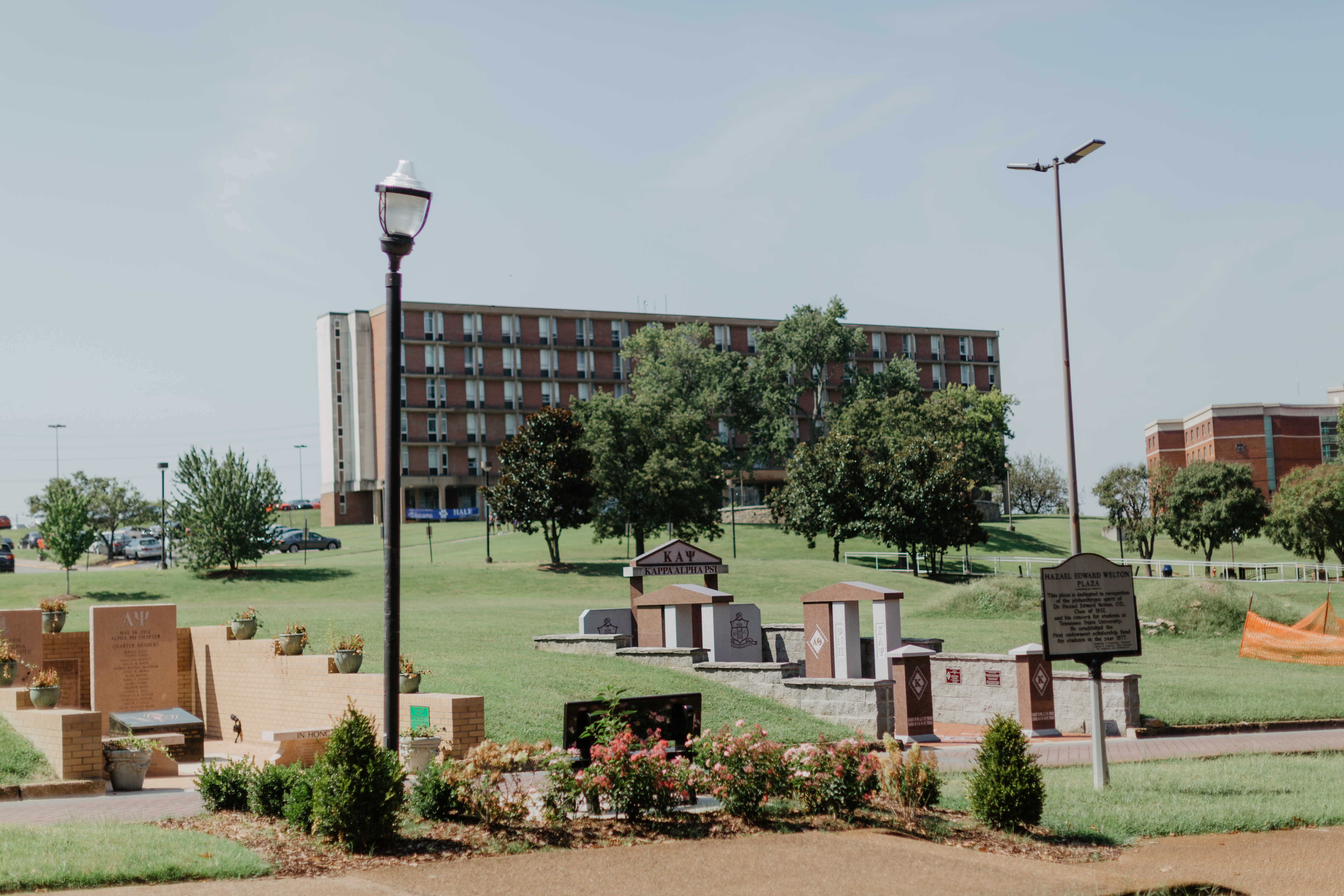 Monuments to several Black Greek Letter Organizations, 2019. Hattie Hale Hall in background. Image courtesy of Sydney Whitten.