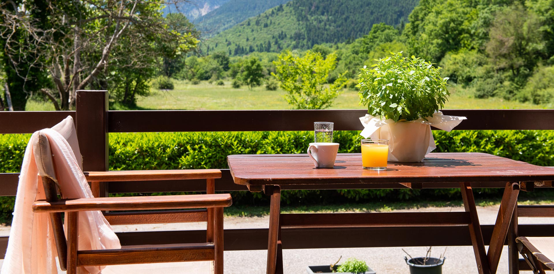 Wooden chair and table with orange juice