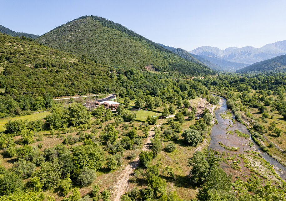 Aerial view of a river surrounded by mountains.