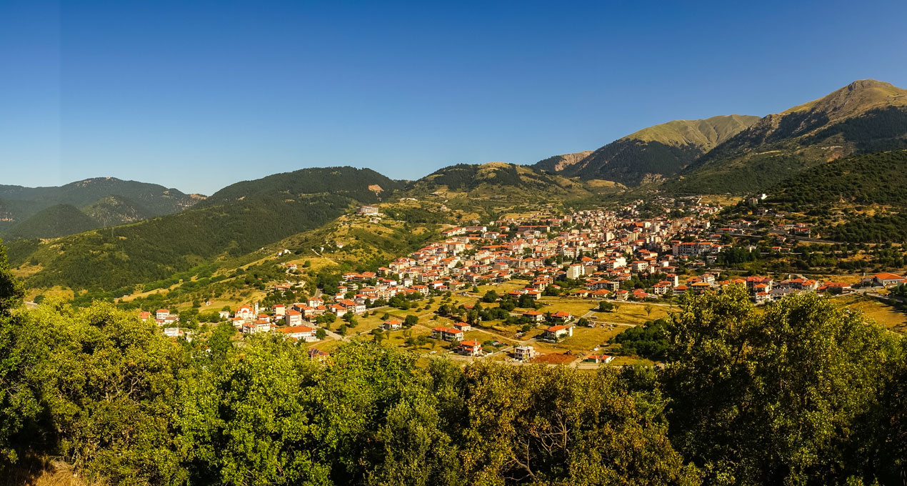 Panoramic view of a village in the mountains.