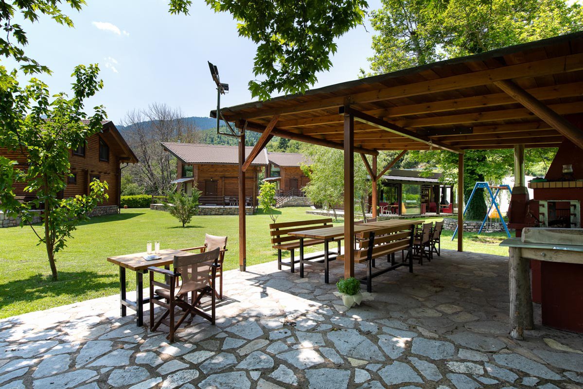 Patio with table and chairs under a pergola
