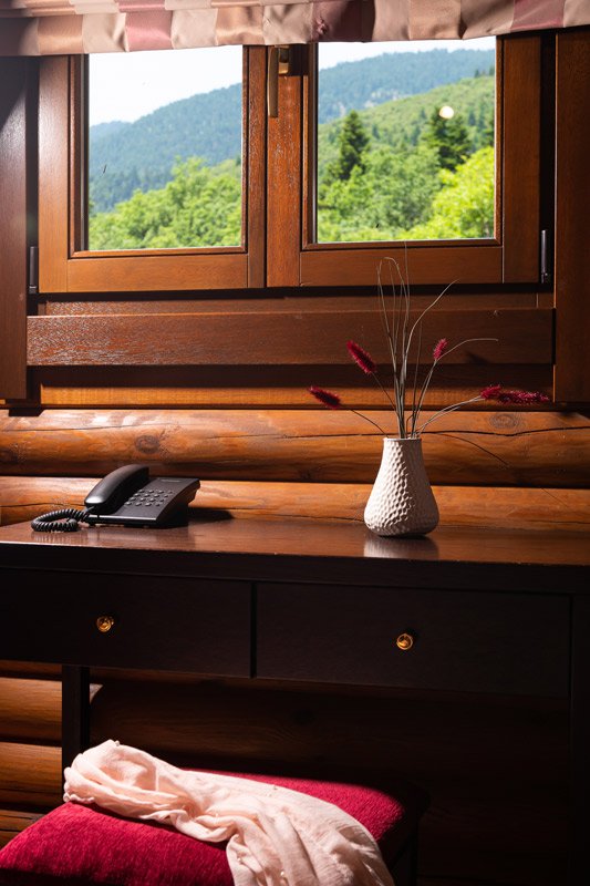 Close up of Natura Chalet Lux's desk with a window above it