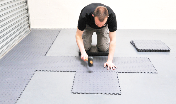 Don’t Want to Paint? These Garage Floor Mats Hide Everything
