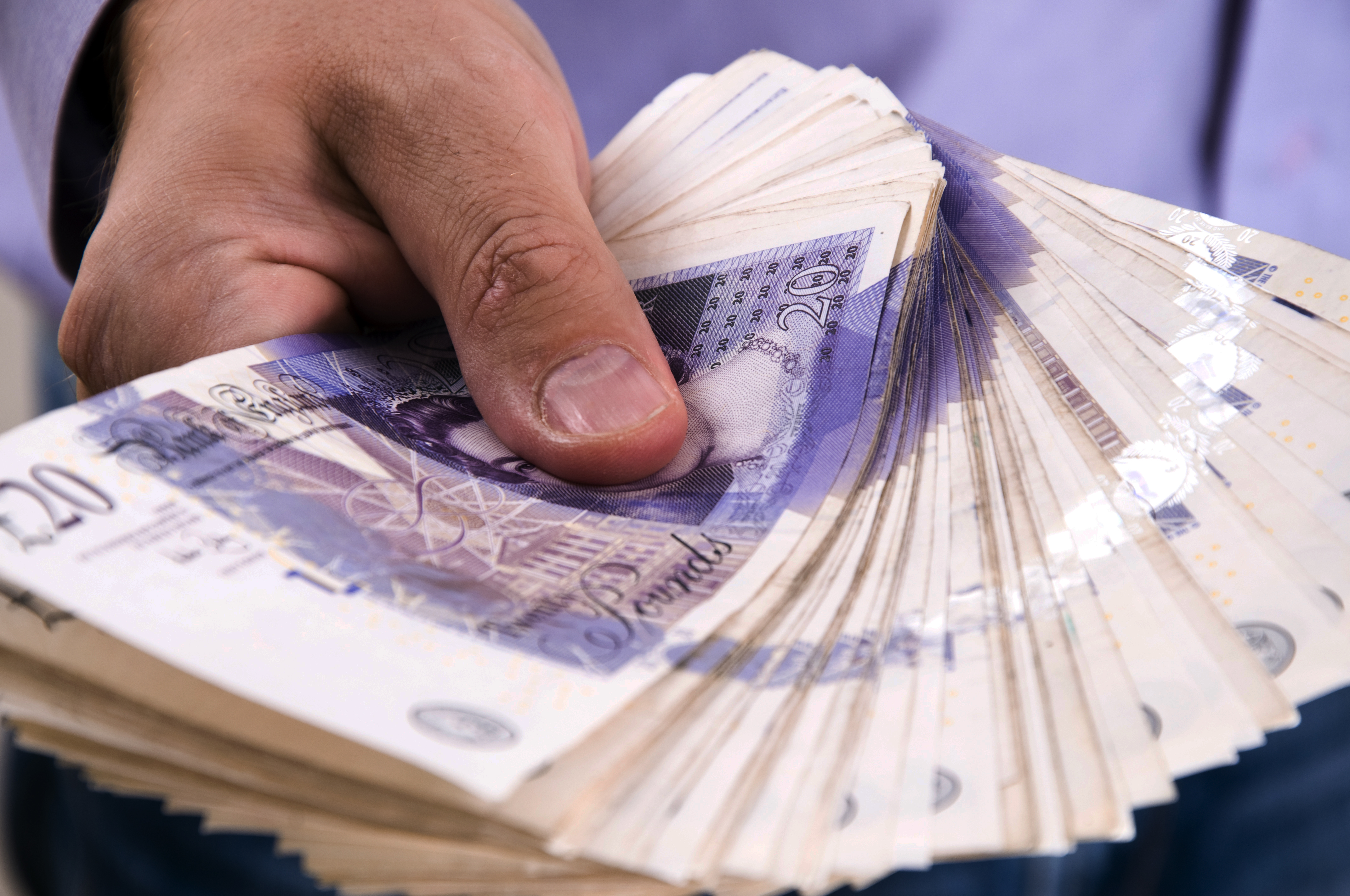 Pound drops as UK job roles hit 2021 low